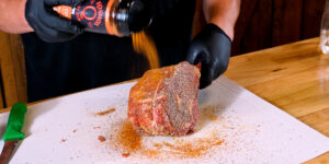 Seasoning Cowboy Ribeye with Kosmos Steak Rub